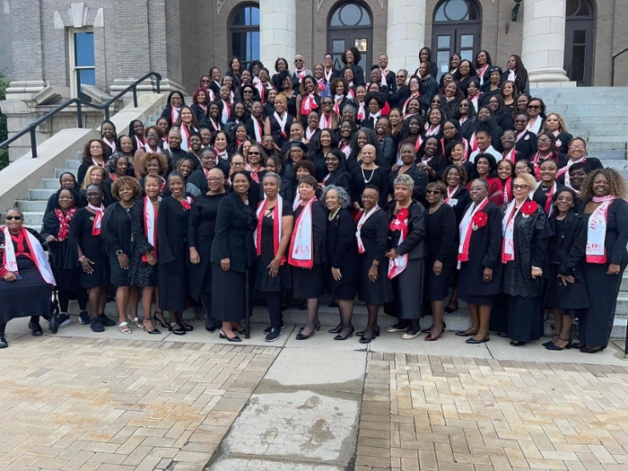 DST members in black and red at their 50th celebration